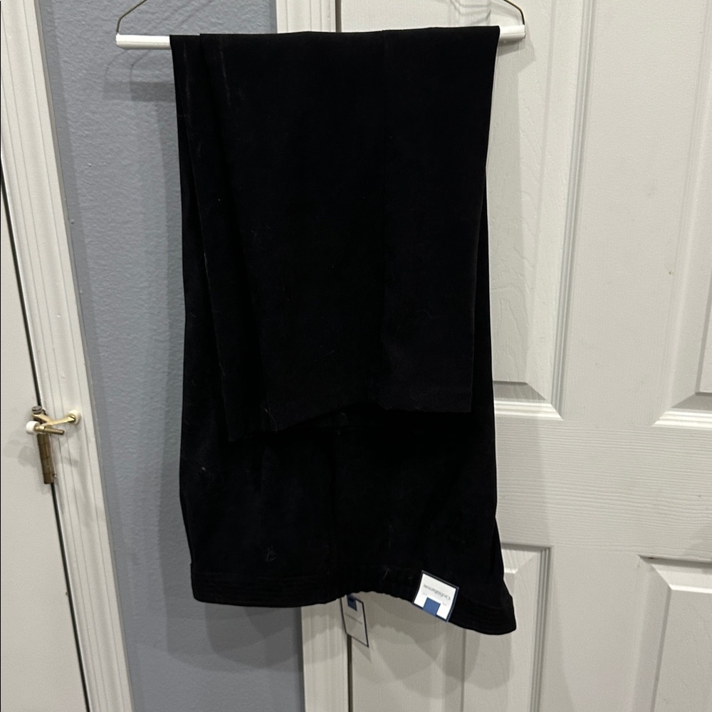 Secretly Slimming Black polyester spandex. Velvety fabric.